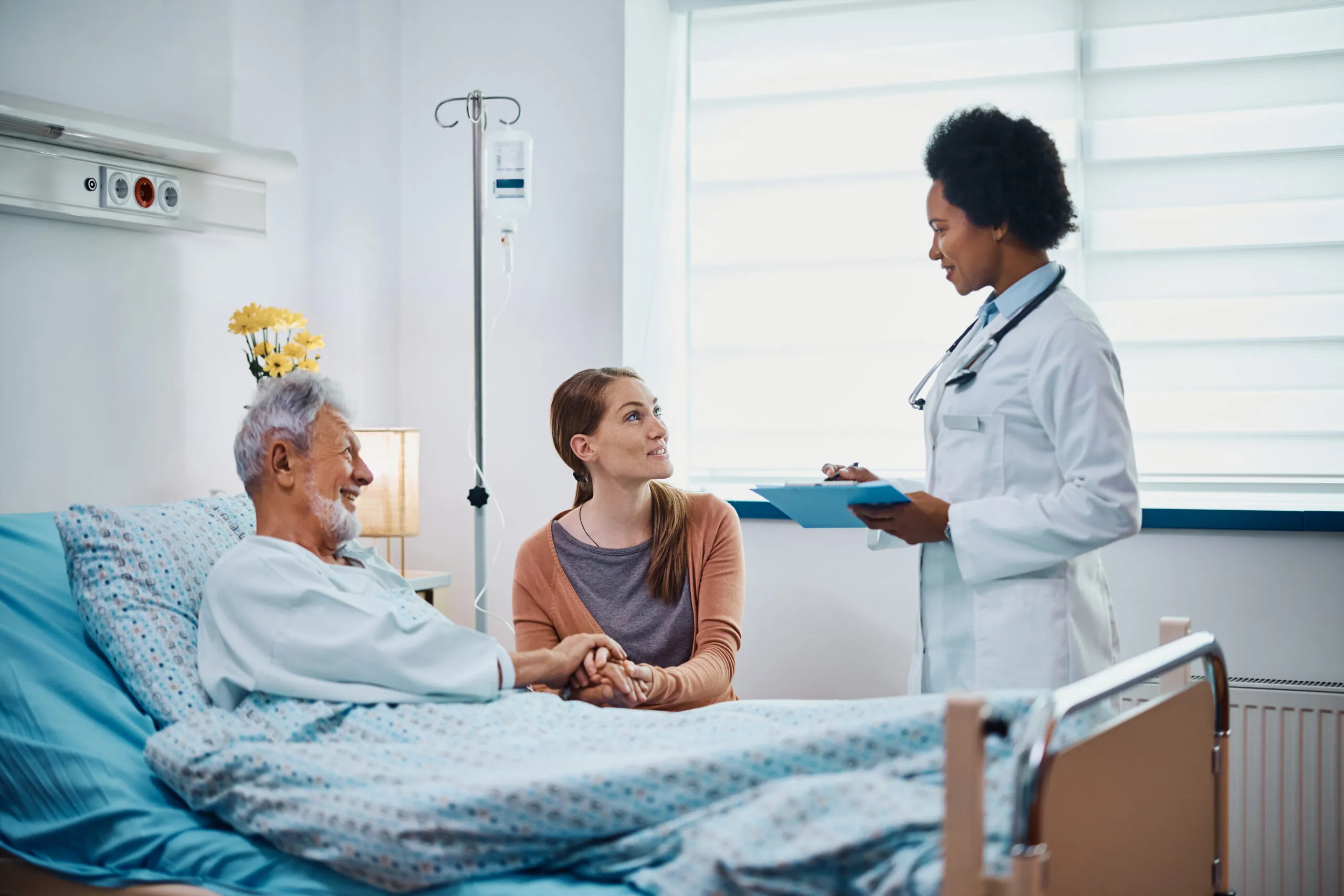 doctor, old man and his daughter in hospital