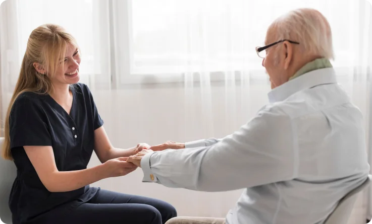 older man gets assistance from his caregiver